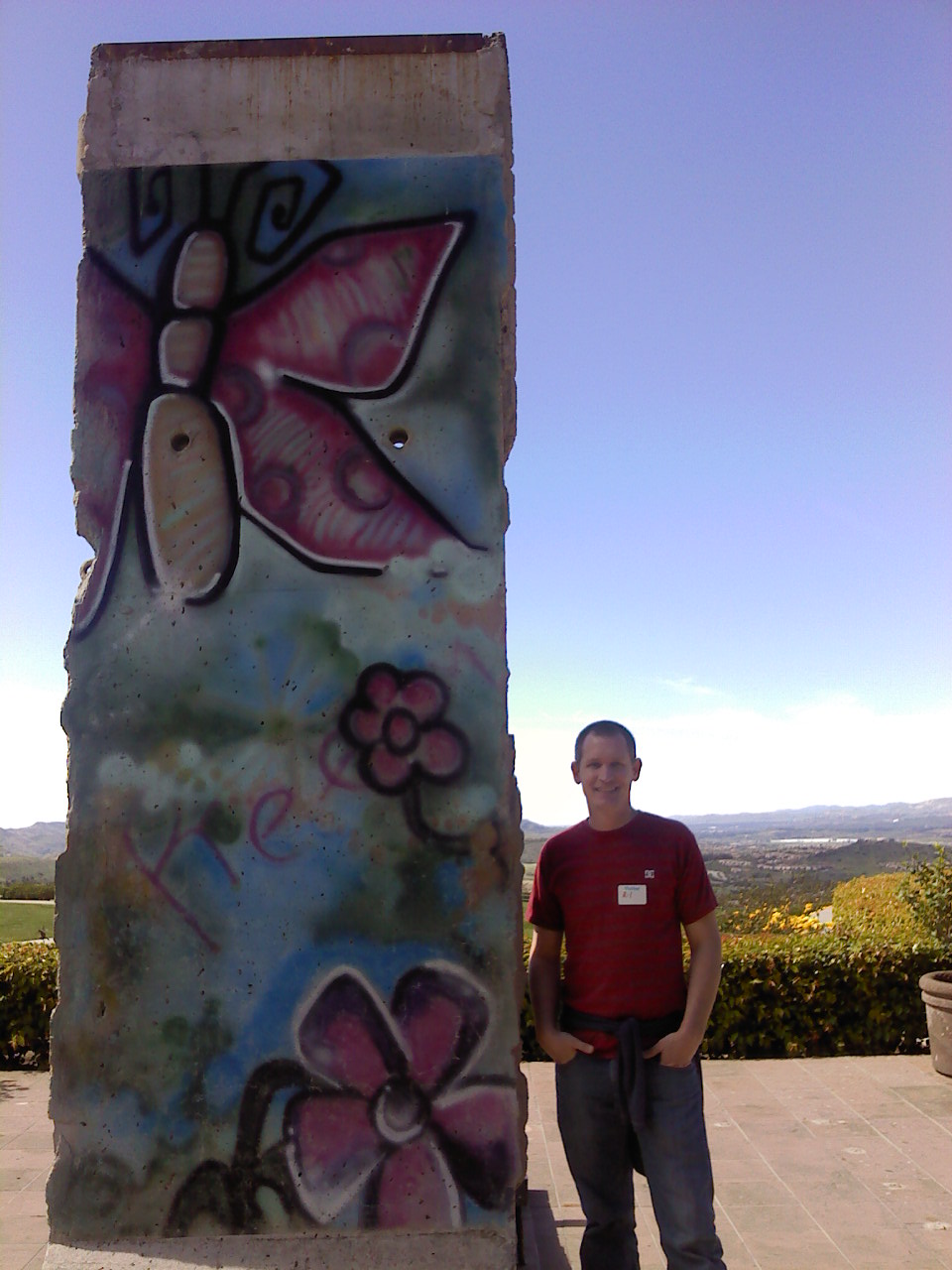 Me with piece of Berlin Wall at the Reagan Library Copy